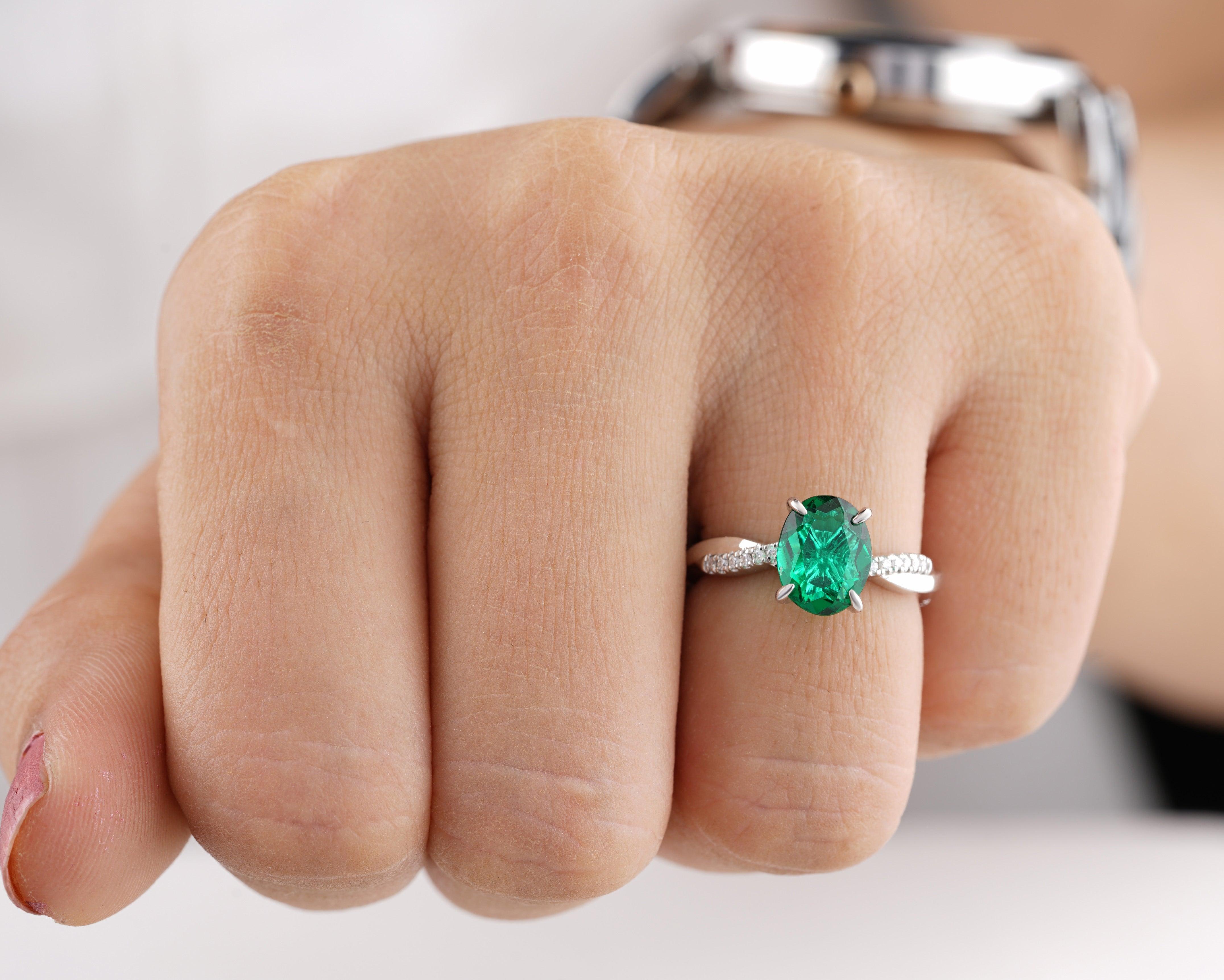Contemporary Oval Emerald and Diamond Cluster Ring at Susannah Lovis  Jewellers